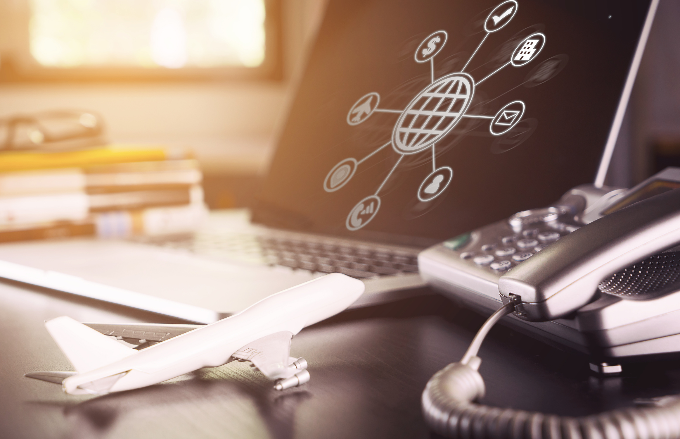 online Travel Agency operator office desk set up with connected icons
