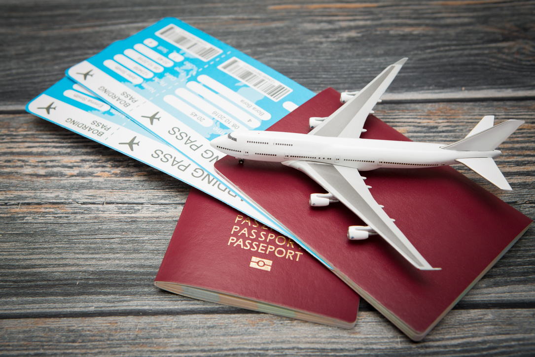 A Toy Airplane On Top Of A Passport